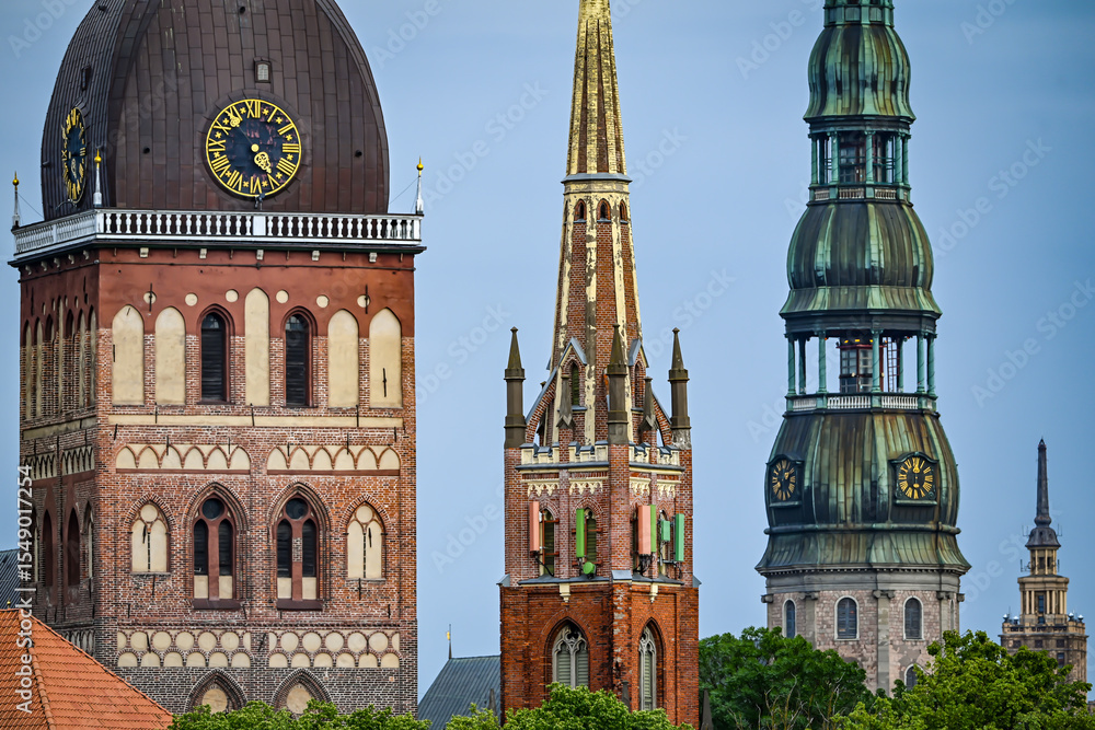 Fototapeta premium Old Riga towers and clocks in Latvia