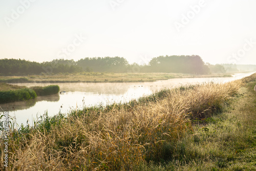 Scenic morning view of water and woodlands in Bentwoud recreation area, in the green heart of Holland.