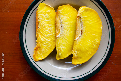 Canvastavla sukun goreng or fried breadfruit served at plate on black background