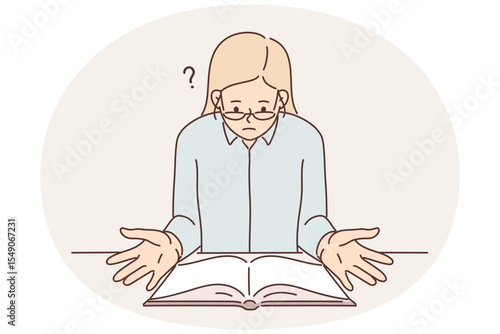 Surprised religious woman sitting at table with open bible reading holy book with christian prayers