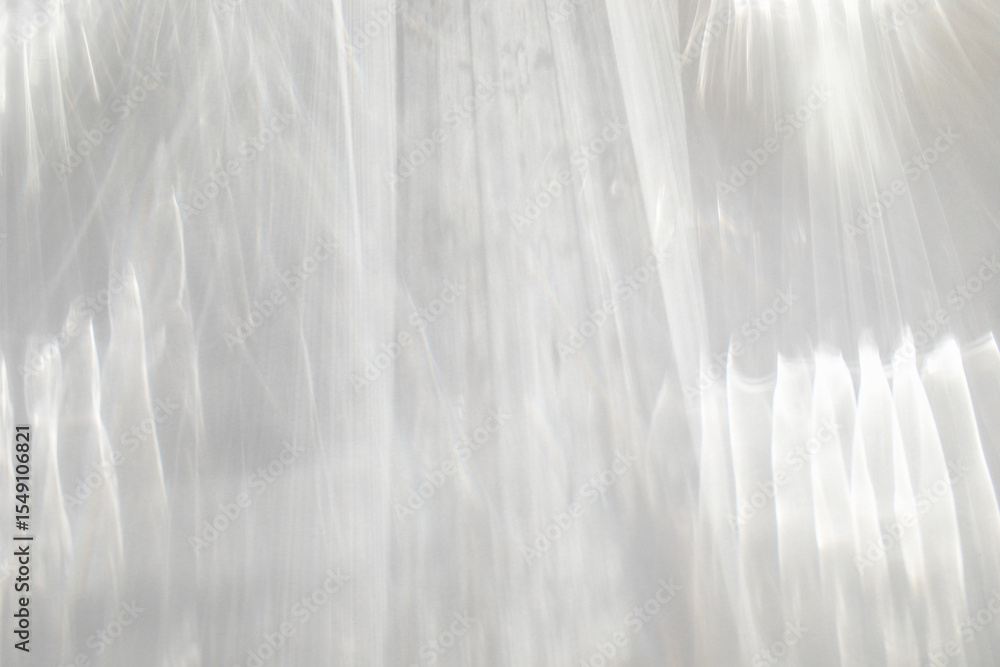 Obraz premium Abstract sunlight shadows background with flare and glare top view. Natural abstarct aesthetic mockup with caustic effects for design and presentation.