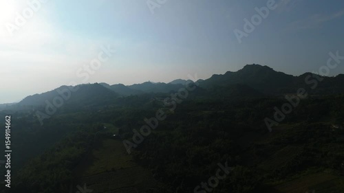 Skyview in the countryside with the village villagers mountain forest waterfall by drone