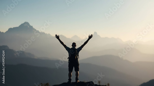 silhouette of a man on a mountaintop