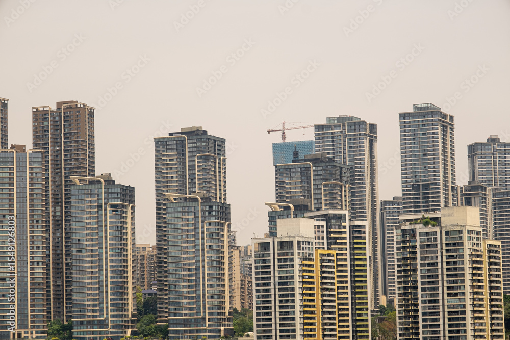 Fototapeta premium modern apartment building with balconies and laundry drying in Chongqing, China