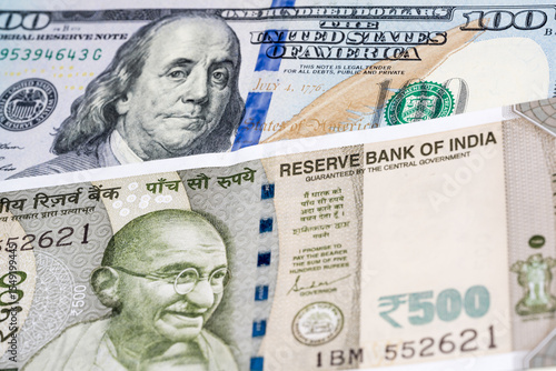 Wallpaper Mural 100 US dollar and 500 Indian rupee banknotes. International trade concept Torontodigital.ca