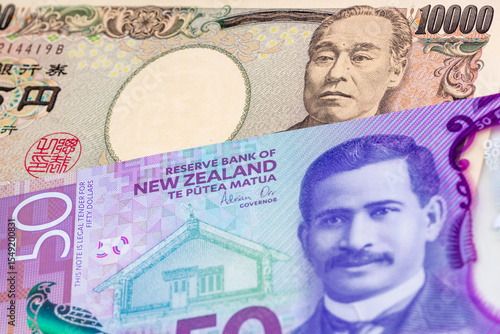 Wallpaper Mural 10000 Japanese yen and 50 New Zealand dollar banknotes. International trade concept Torontodigital.ca