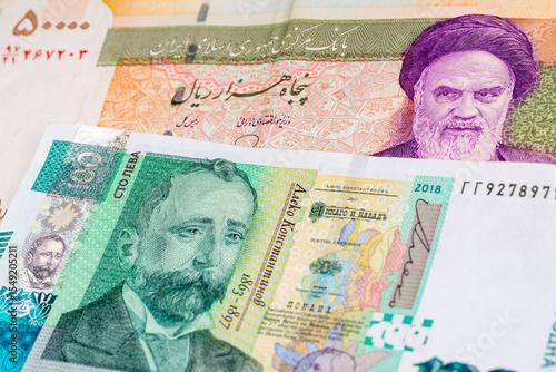 Wallpaper Mural 50000 Iranian rial and Bulgarian lev banknotes. International trade concept Torontodigital.ca