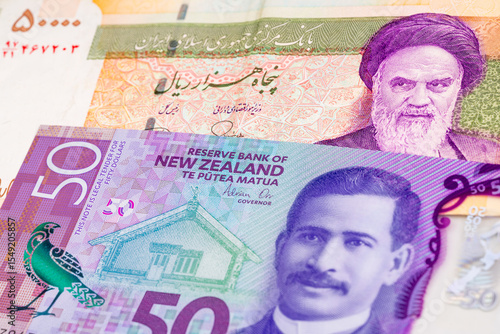Wallpaper Mural 50000 Iranian rial and 50 New Zealand dollar banknotes. International trade concept Torontodigital.ca