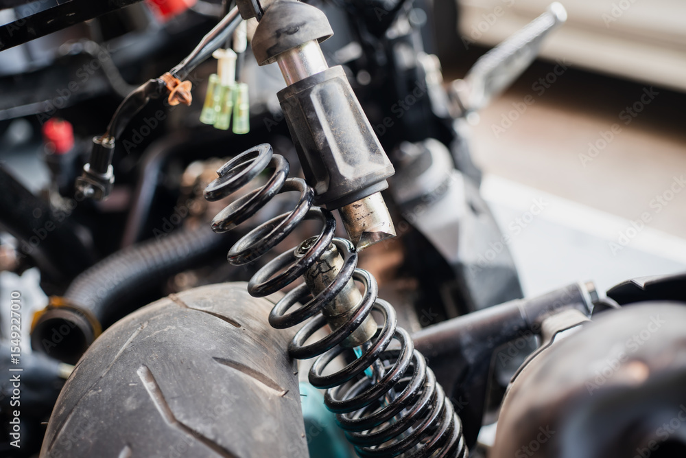 Fototapeta premium motorcycle rear shock absorbers is broken, damaged rear shock. motorcycle repair concept