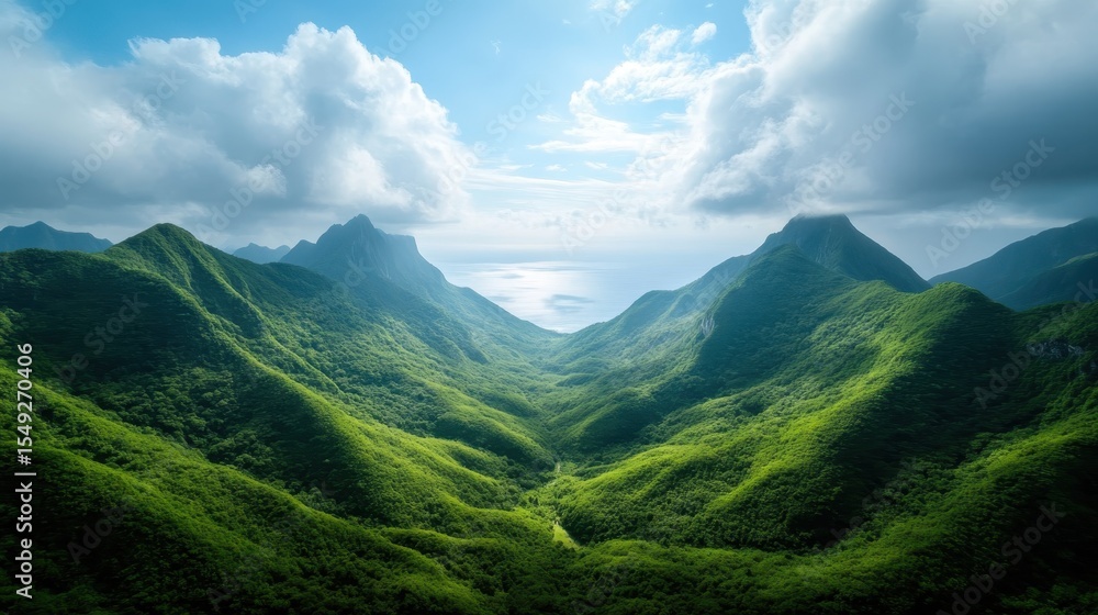 Naklejka premium This breathtaking landscape captures the grandeur of mountains rising over a serene ocean, highlighting nature's magnificence and the sense of tranquility found in untouched wilderness.