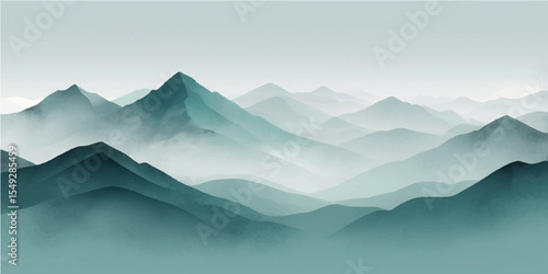 Foggy morning mountain landscape with a view of snow-capped peaks under a cloudy sky