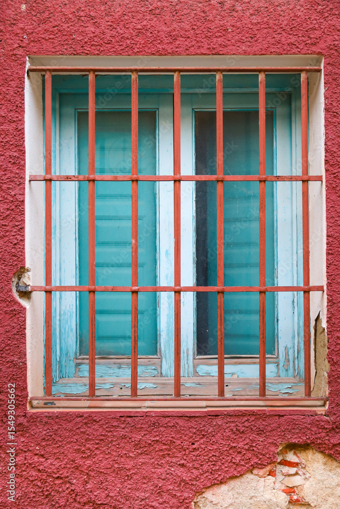 Obraz premium Stone facade with window with wrought iron lattice in Spain