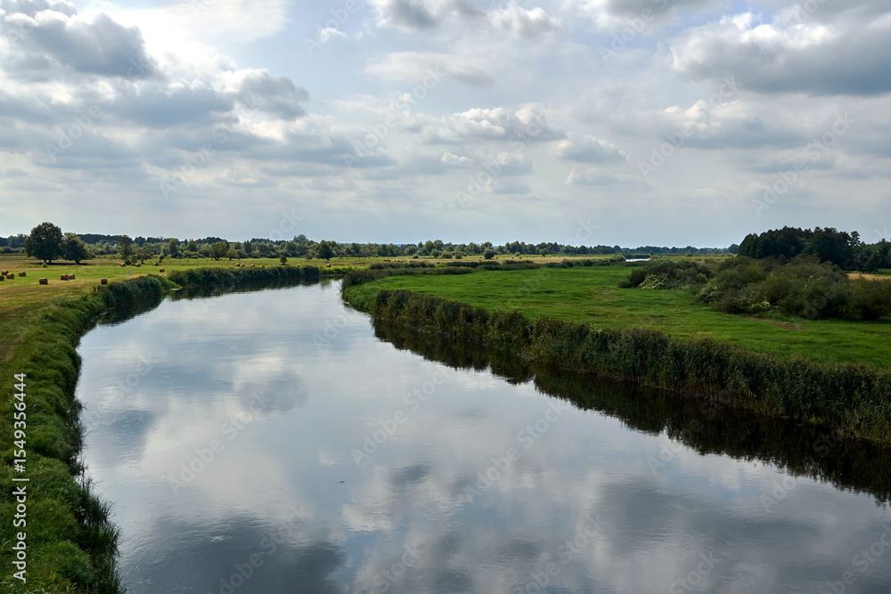 rural landscape with pastures by the Notec River in summer rural landscape with pastures by the Notec River in summer