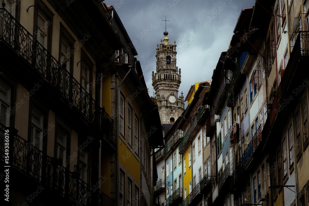 Fototapeta premium Clerigos Tower framed by buildings in Porto.