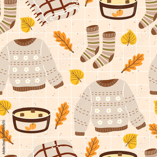Seamless vector pattern featuring cozy sweaters, socks, and autumn leaves. Hand-drawn design ideal for warm seasonal textiles, wrapping paper, and childrens clothing