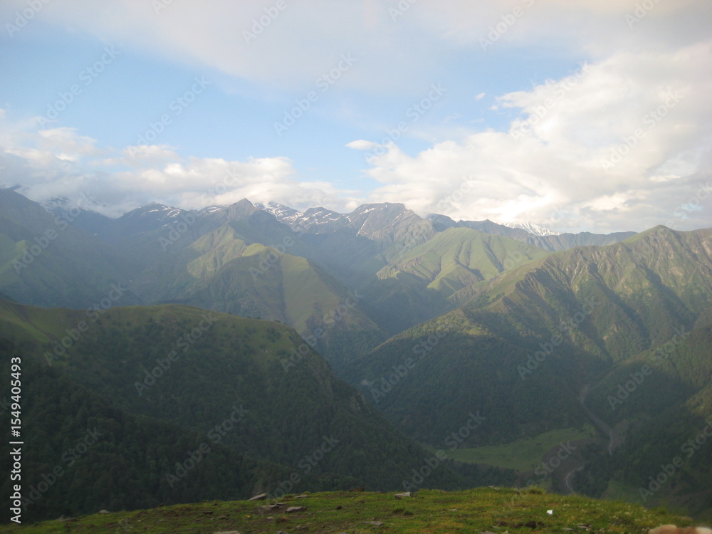 Naklejka premium mountain landscape with clouds