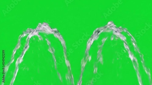 Dynamic Water Fountain Displaying Arcing Water Jets Against Vibrant Green Screen