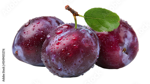 Three juicy plums with water droplets and a leaf