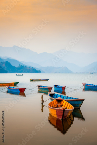 Colourful boats on Pokhara lake side in Nepal.
