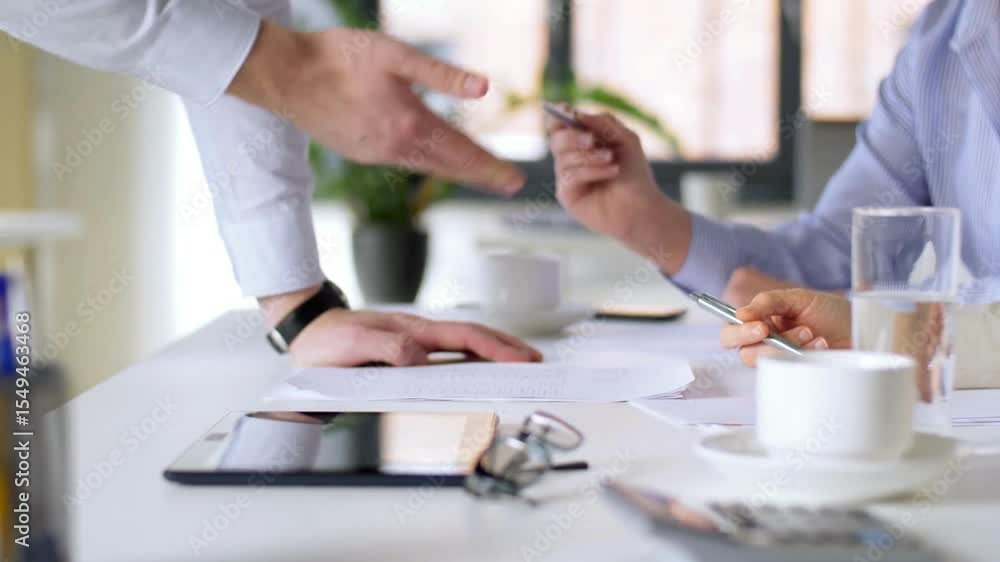 Leader man and business partners analyze papers with charts and graphs. Briefing, discuss project about stock market trading in corporate office Leader man and business partners analyze papers with charts and graphs. Briefing, discuss project about stock market trading in corporate office
