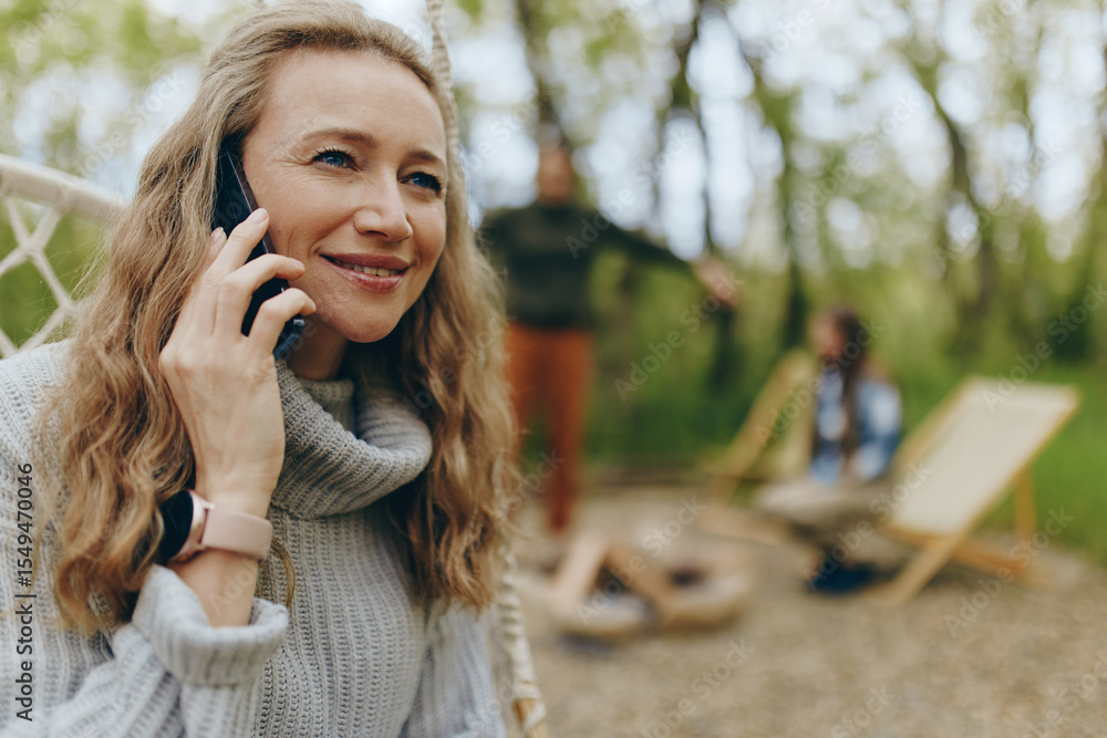 Middle-aged woman enjoying healthy outdoor lifestyle, active wellbeing and community in natural setting Middle-aged woman enjoying healthy outdoor lifestyle, active wellbeing and community in natural setting