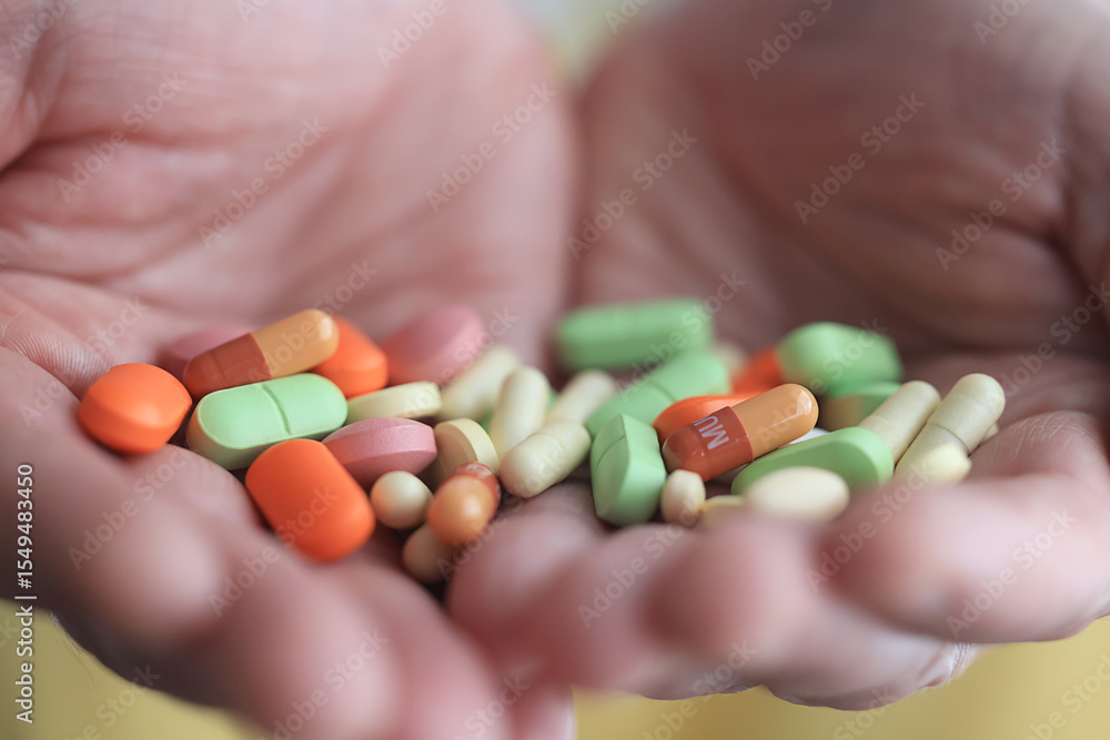 a lot of pills in the palm of a person's hand, medical background a lot of pills in the palm of a person's hand, medical background