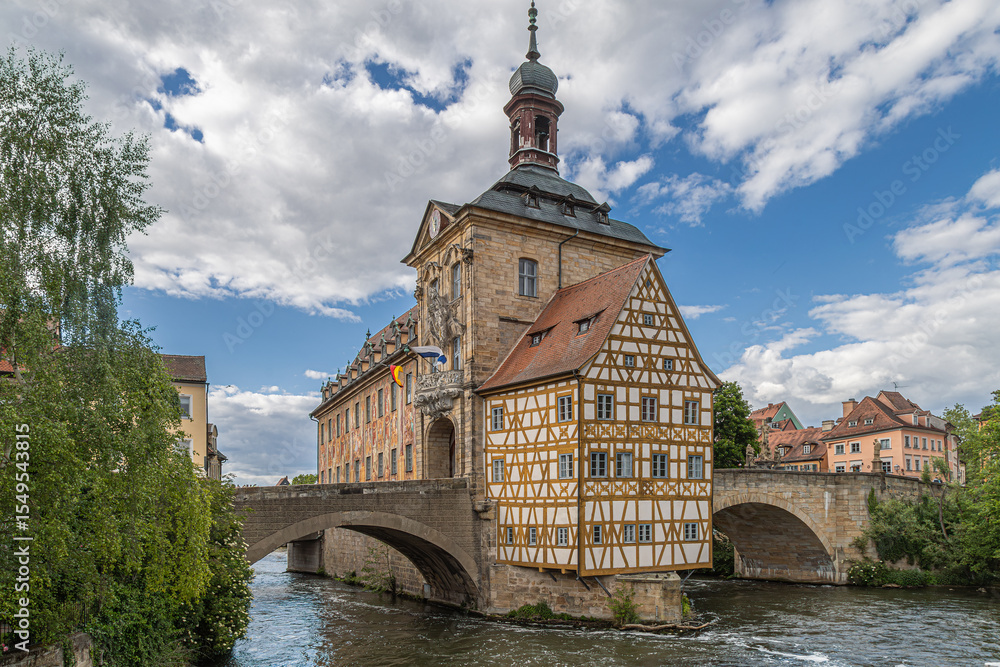 Fototapeta premium The Old Town Hall (Alte Rathaus) in Bamberg, Germany, decorated with frescoes, on island at the Regnitz river.Mentioned in 1387, rebuilt 1461-1467,redesigned in the Baroque and Rococo styles 1744-1756