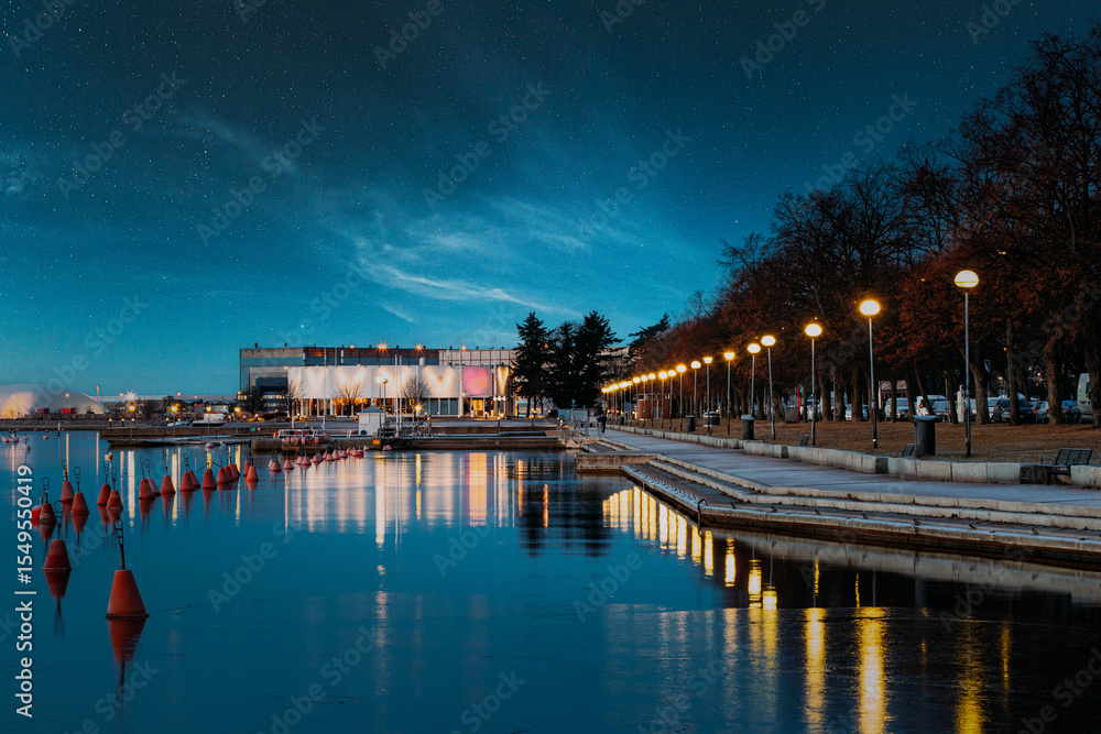 Fototapeta premium Helsinki, Finland. Night View Of City Park Meripuisto. Street Promenade At Night. Night stars sky