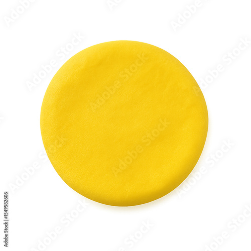 A single, round disc of bright yellow modeling clay, isolated on a white background.