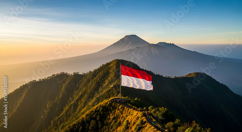 Majestic Indonesian Flag atop Mountain Ridge with Volcanic Backdrop at Sunrise