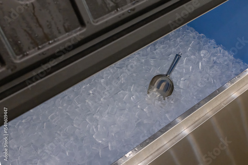 Ice cubes store in ice making machine for clean product. Ice cube maker. Cube ice machine. Suitable for small beverage shops.