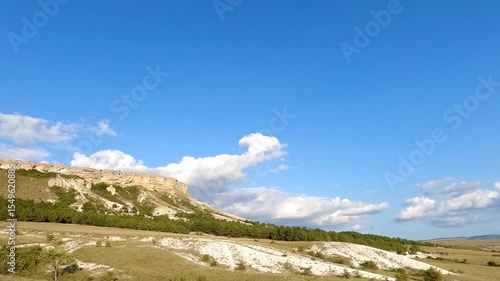 White rocks and clouds on a sunny summer day, timelapse shooting