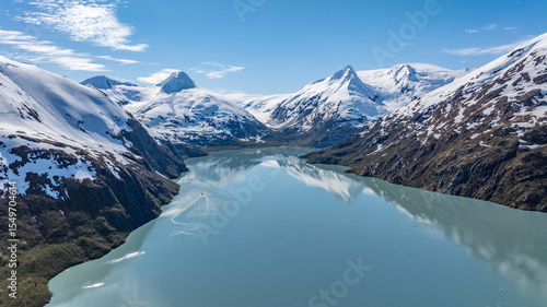 aerial landscape view of Portage Lake with surrounding mountain landscape at Portage Glacier in Alaska with snow covered mountains around the glacier lake