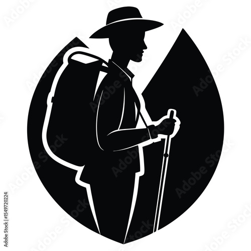 Silhouette of a hiker with a backpack and trekking poles against a mountain backdrop
