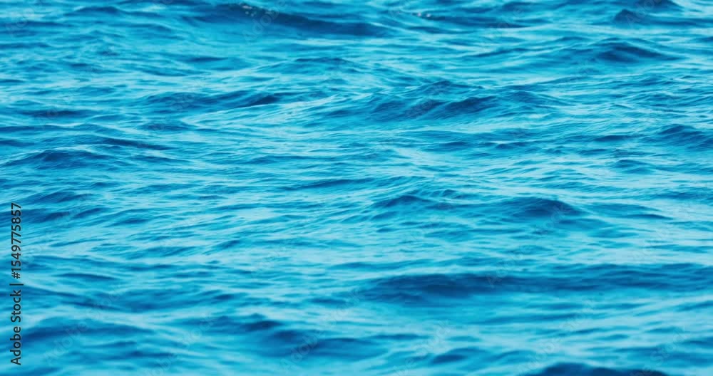 Blue crystal clear water. Perfect seascape in slow motion. Sea wave low angle view. Ocean surface, deep blue water color and waves. Blue waves sea water. Blue crystal clear water. Perfect seascape in slow motion. Sea wave low angle view. Ocean surface, deep blue water color and waves. Blue waves sea water.