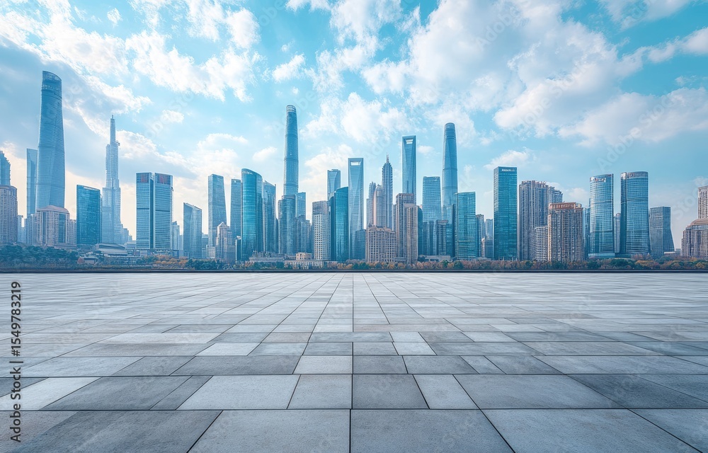 Empty paved plaza before modern city skyline Empty paved plaza before modern city skyline