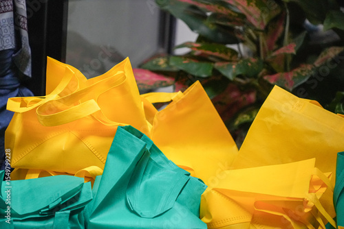 Photography A view of several yellow and green goodie bags in the garden, seen at the celebration