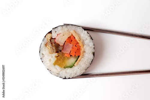 Kimbap picked up with chopsticks. Korean food.