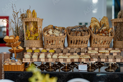 Canvas Print Creative display of various types of bread artfully arranged on a buffet table in a restaurant
