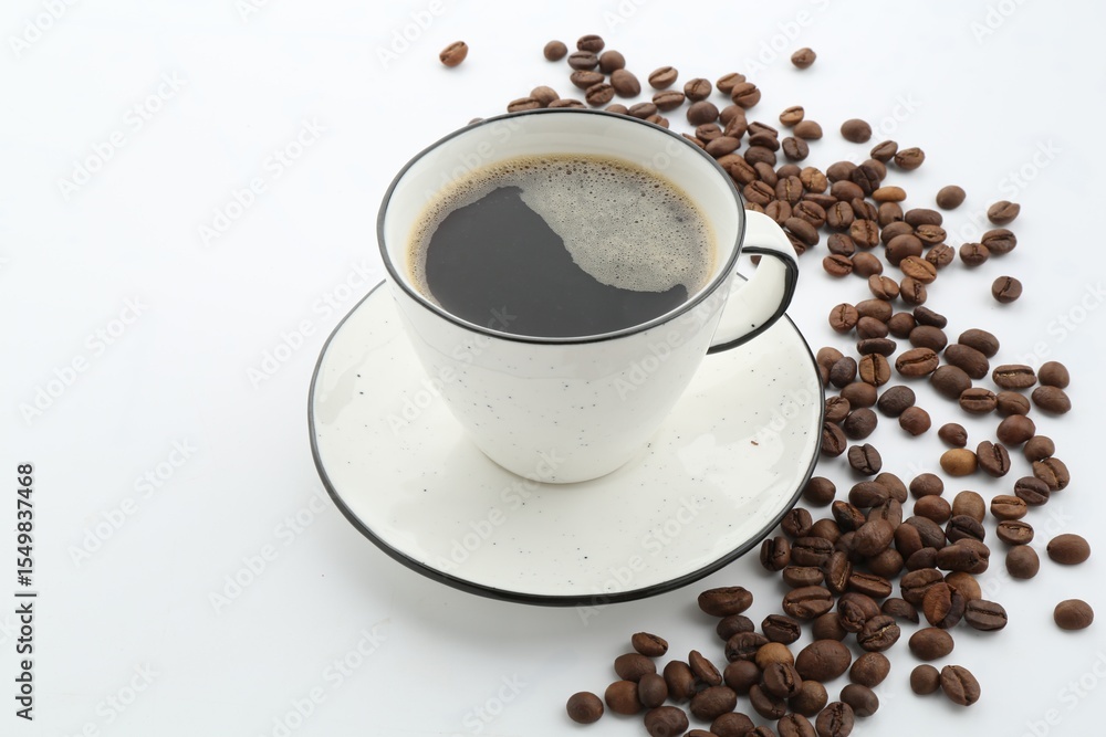 Fototapeta premium Aromatic coffee in cup and beans isolated on white