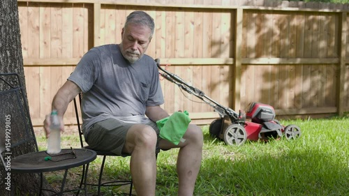 dehydrated senior man sitting suffering from heat stroke