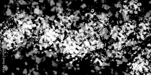 Snowflakes on dark background. white icy snowflakes isolated on black background, natural background. white crystalline powder on a black background. sugar dust. texture, pattern and clipping.