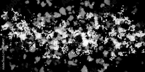 Snowflakes on dark background. white icy snowflakes isolated on black background, natural background. white crystalline powder on a black background. sugar dust. texture, pattern and clipping.