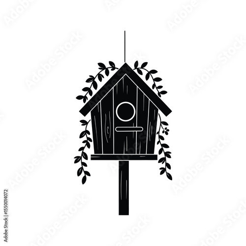 Black silhouette of a birdhouse adorned with delicate vines perfect for spring garden themes
