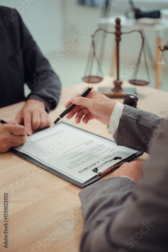 Businessmen consult with lawyers, submit additional documents, and pay for lawyers' services. After reaching an agreement and signing the contract, the two shake hands. Concept, Justice, and Lawyers
