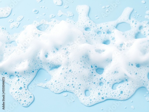 Light blue surface covered with white soapy foam