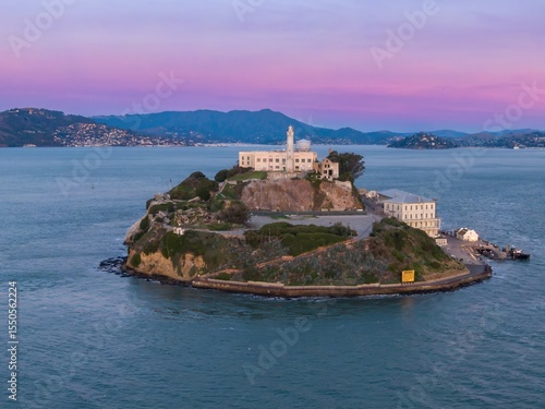 Alcatraz Island, USA, at dusk. The former prison, now a tourist destination, sits in the San Francisco Bay. The image captures the island's isolation and history.