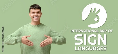 Young deaf mute man on gree...