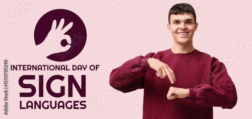 Young deaf mute man on pink...
