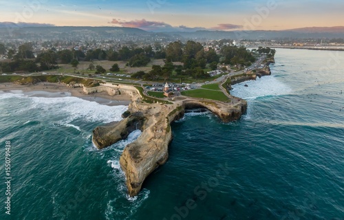 Photography Aerial view of people surfing and enjoying the beach at Natural Bridges State Beach in Santa Cruz, California, USA